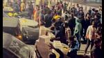The chaotic gathering near the Engineering Square Over Bridge caused a public nuisance, with some individuals dangerously standing on the road divider (Sourced) The chaotic gathering near the Engineering Square Over Bridge caused a public nuisance, with some individuals dangerously standing on the road divider (Sourced)