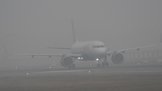 Aircraft operations at Chennai Airport have been disrupted by the Airports Authority of India (AAI) cancelling three flights and rescheduling thirty others due to the high fog and smoke from burning trash during the Bhogi festival.(Hindustan Times/ Santosh Kumar)