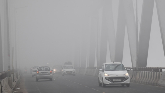 Vehicles crossing in low visibility due to fog at JP Setu in Patna, Bihar, India, Wednesday,15, 2025.(Santosh Kumar/ Hindustan Times)