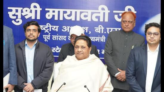 Ishan Anand standing left of BSP chief Mayawati in the review meeting held on Thursday. (Sourced) Ishan Anand standing left of BSP chief Mayawati in the review meeting held on Thursday. (Sourced)