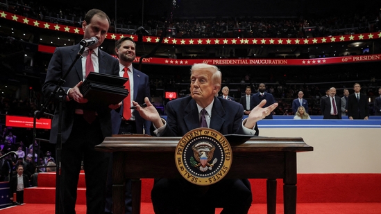 The US President Donald Trump gestures on the day he signs the freedom of speech executive order during the inaugural parade inside Capital One Arena on the inauguration day of his second presidential term, in Washington.(REUTERS)