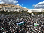 An aerial photo shows crowds of Syrians raising a giant independence-era flag, used by the opposition since the uprising began in 2011, as they celebrate the fall of Bashar al-Assad's iron-fisted rule earlier this week at the central Umayyad Square in Damascus on December 13, 2024.(AFP) An aerial photo shows crowds of Syrians raising a giant independence-era flag, used by the opposition since the uprising began in 2011, as they celebrate the fall of Bashar al-Assad's iron-fisted rule earlier this week at the central Umayyad Square in Damascus on December 13, 2024.(AFP)