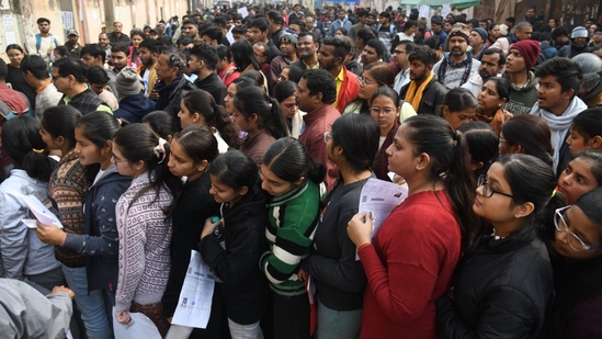Aspirants outside an examination centre at Patliputra in Patna waiting to appear for JEE Main exam 2025. (Santosh Kumar )