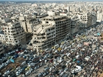 This aerial photo shows Syrians gathering near a destroyed building in the central city of Homs as they celebrate the fall of Bashar al-Assad's iron-fisted rule. (AFP) This aerial photo shows Syrians gathering near a destroyed building in the central city of Homs as they celebrate the fall of Bashar al-Assad's iron-fisted rule. (AFP)