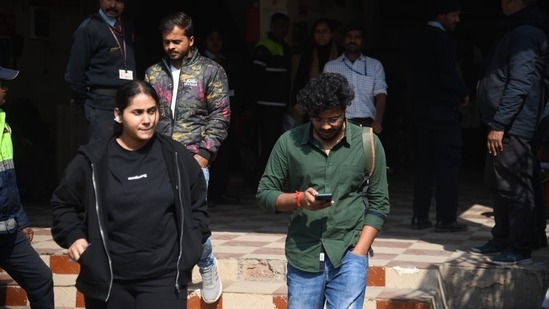 Aspirants coming out after appeared in the Common Management Admission Test (CMAT) exam at an examination centre at Patliputra in Patna. (Santosh Kumar )