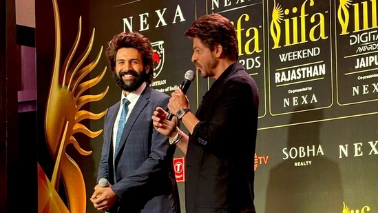 Kartik Aaryan and Shah Rukh Khan attended an IIFA event in Mumbai. Kartik Aaryan and Shah Rukh Khan attended an IIFA event in Mumbai.