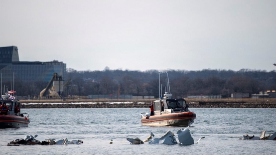 The American Coast Guard, along with other search and rescue teams, operates near debris in Washington, in the aftermath of the collision between American Eagle flight 5342 and a Black Hawk helicopter that crashed into the Potomac River, USA.(REUTERS)