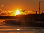 A couple take a walk at sunrise near the icy Oak Street Beach along the shore of Lake Michigan Monday, Jan. 20, 2025, in Chicago (AP/Kiichiro Sato) A couple take a walk at sunrise near the icy Oak Street Beach along the shore of Lake Michigan Monday, Jan. 20, 2025, in Chicago (AP/Kiichiro Sato)