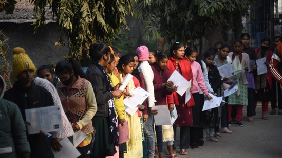 Students wait with their admit cards to appear for the BSEB class 12 examination in Patna(Santosh Kumar)