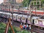 Mumbai weather: Mumbai's local train services on the Central Railway were affected after an overhead equipment pole between Thane and Mulund stations got bent due to strong winds. (HT photo/ Praful Gangurde) Mumbai weather: Mumbai's local train services on the Central Railway were affected after an overhead equipment pole between Thane and Mulund stations got bent due to strong winds. (HT photo/ Praful Gangurde)