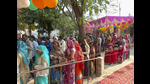 People wait to cast their votes during the Milkipur Assembly by-election on Wednesday (PTI) People wait to cast their votes during the Milkipur Assembly by-election on Wednesday (PTI)