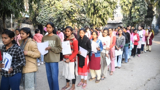 Students wait to enter the exam hall to appear for the Physics exam of the ongoing BSEB Class 12 board exam in Patna.(Santosh Kumar)
