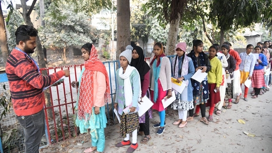 Officials check the details of the candidates waiting to appear for the BSEB Class 12 Exams in Patna(Santosh Kumar)
