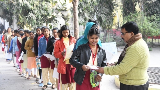 Students show their admit cards to officials to appear for the Day 3 of BSEB Class 12 Board exams in Patna(Santosh Kumar)