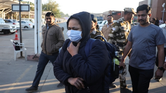An Indian immigrant deported from the US walks out of Ahmedabad Airport on February 6, 2025. Upon arrival, the 33 deportees, including children and women, were transported to their hometowns in Gujarat in police vehicles, according to the Assistant Commissioner of Police, 'G' Division.(Reuters)