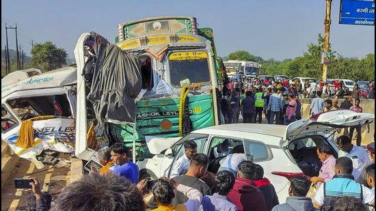 People gather at the accident site in Jabalpur in Madhya Pradesh on Tuesday. (PTI)