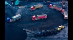 Trucks wait to be loaded with coal, to be taken to a coal-fired power plant, at a coal storage facility in Chongqing, in southwest China on February 12, 2025. (Photo by AFP) / China OUT (AFP) Trucks wait to be loaded with coal, to be taken to a coal-fired power plant, at a coal storage facility in Chongqing, in southwest China on February 12, 2025. (Photo by AFP) / China OUT (AFP)