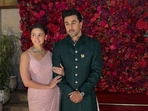 Alia Bhatt opted for a pastel pink sequined saree, while Ranbir wore a a rich dark green bandhgala sherwani. Alia Bhatt opted for a pastel pink sequined saree, while Ranbir wore a a rich dark green bandhgala sherwani.