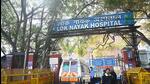 Security personnel stand guard outside the Lok Nayak Jai Prakash (LNJP) Hospital on February 17. (Arvind Yadav/HT Photo) Security personnel stand guard outside the Lok Nayak Jai Prakash (LNJP) Hospital on February 17. (Arvind Yadav/HT Photo)