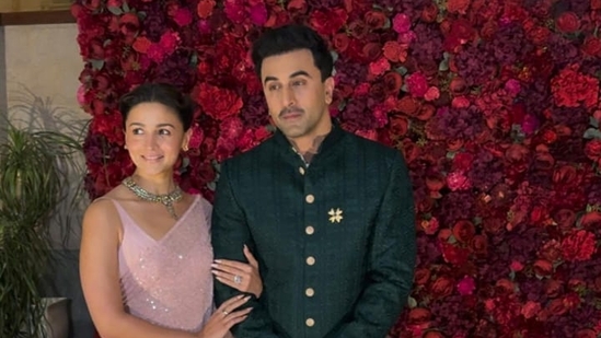 Alia Bhatt opted for a pastel pink sequined saree, while Ranbir wore a a rich dark green bandhgala sherwani. Alia Bhatt opted for a pastel pink sequined saree, while Ranbir wore a a rich dark green bandhgala sherwani.