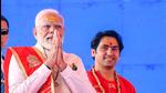 Prime Minister Narendra Modi greets people during the foundation stone laying ceremony of Bageshwar Dham Medical and Science Research Institute, in Madhya Pradesh’s Chhatarpur on Sunday. (DPR PMO) Prime Minister Narendra Modi greets people during the foundation stone laying ceremony of Bageshwar Dham Medical and Science Research Institute, in Madhya Pradesh’s Chhatarpur on Sunday. (DPR PMO)