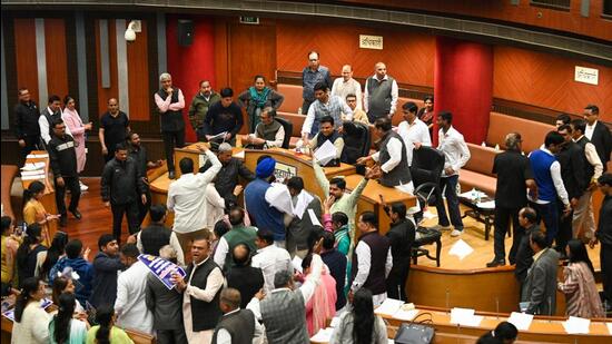 Councillors grapple with one another at the MCD meeting. (Sanchit Khanna/HT Photo) Councillors grapple with one another at the MCD meeting. (Sanchit Khanna/HT Photo)