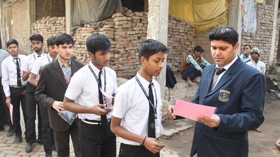 An official checking the documents of students before the commencement of CBSE Class 10 examination. (Santosh Kumar )
