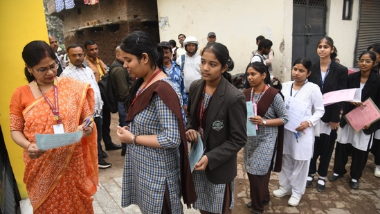 Students who will appear for CBSE Class 10 Hindi exam showing their admit card at St. Dominic savio's high school Danapur in patna (Santosh Kumar )