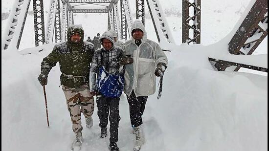 Army personnel conduct a rescue operation after 57 workers engaged in road construction got trapped under huge blocks of snow during an avalanche, in Chamoli in Uttarakhand on Friday. (ANI) Army personnel conduct a rescue operation after 57 workers engaged in road construction got trapped under huge blocks of snow during an avalanche, in Chamoli in Uttarakhand on Friday. (ANI)