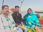 Pintu Mahra with his kin, including his mother, Shuklawati Mahra, on the Sangam banks in Prayagraj.(HT_PRINT) Pintu Mahra with his kin, including his mother, Shuklawati Mahra, on the Sangam banks in Prayagraj.(HT_PRINT)