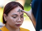 A Catholic nun applies ash to a woman's forehead on the observance of Ash Wednesday at a church ground in Manila on March 5, 2025. The 40-day period of Lent begins on Ash Wednesday, with Catholics around the world observing the season which culminates in Easter Sunday. (Photo by Ted ALJIBE / AFP)(AFP) A Catholic nun applies ash to a woman's forehead on the observance of Ash Wednesday at a church ground in Manila on March 5, 2025. The 40-day period of Lent begins on Ash Wednesday, with Catholics around the world observing the season which culminates in Easter Sunday. (Photo by Ted ALJIBE / AFP)(AFP)