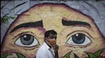 A masked man walks past graffiti in Pune, in 2020. (HT Archives) A masked man walks past graffiti in Pune, in 2020. (HT Archives)