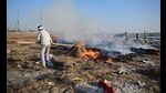Sanitation workers burning straw dumps in Sector 21 of the mela on Saturday. (Anil Kumar Maurya/HT) Sanitation workers burning straw dumps in Sector 21 of the mela on Saturday. (Anil Kumar Maurya/HT)