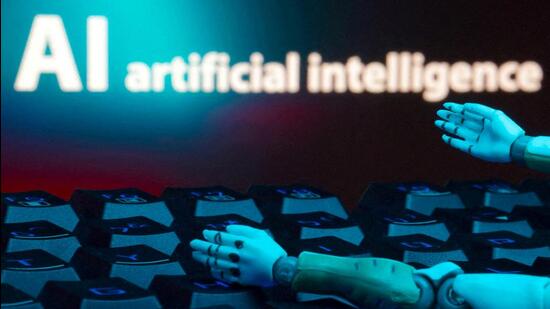 FILE PHOTO: A message reading "AI artificial intelligence", a keyboard, and robot hands are seen in this illustration (REUTERS) FILE PHOTO: A message reading "AI artificial intelligence", a keyboard, and robot hands are seen in this illustration (REUTERS)