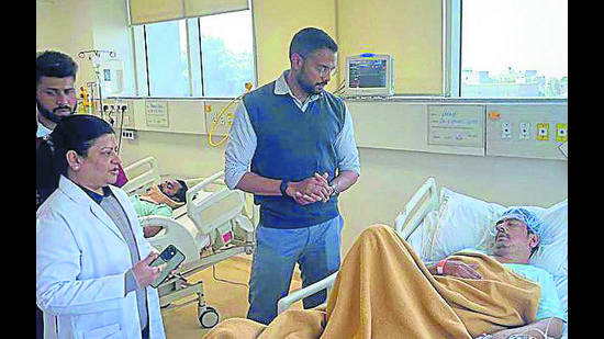 Ludhiana DC Jitendra Jorwal interacting with injured workers at a private hospital in Ludhiana on Monday. (HT Photo) Ludhiana DC Jitendra Jorwal interacting with injured workers at a private hospital in Ludhiana on Monday. (HT Photo)