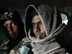 In this undated photo, Gangster Aman Sao in police custody. Sao was killed in an encounter when members of his gang tried to free him from police custody in Jharkhand's Palamu district, while being brought to Ranchi from Raipur jail, Tuesday.(PTI) In this undated photo, Gangster Aman Sao in police custody. Sao was killed in an encounter when members of his gang tried to free him from police custody in Jharkhand's Palamu district, while being brought to Ranchi from Raipur jail, Tuesday.(PTI)