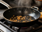 Sizzling hot frying pan sears delicious flavors with golden perfection. Sizzling hot frying pan sears delicious flavors with golden perfection.