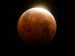FILE - Light shines from a total lunar eclipse over Santa Monica Beach in Santa Monica, Calif., Wednesday, May 26, 2021. (AP Photo/Ringo H.W. Chiu, File)(AP) FILE - Light shines from a total lunar eclipse over Santa Monica Beach in Santa Monica, Calif., Wednesday, May 26, 2021. (AP Photo/Ringo H.W. Chiu, File)(AP)