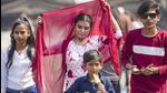A woman shields herself from the sun as a child eats an ice-cream to beat the heat in Mumbai. (PTI Photo) A woman shields herself from the sun as a child eats an ice-cream to beat the heat in Mumbai. (PTI Photo)