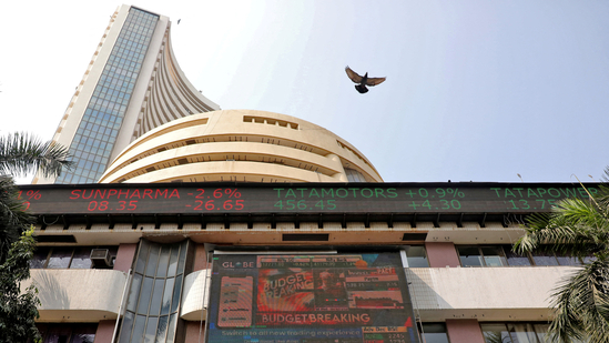 A bird flies past a screen displaying the Sensex results on the facade of the Bombay Stock Exchange (BSE) building in Mumbai, February 1, 2023(Niharika Kulkarni/Reuters)