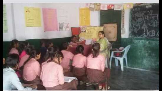 A teacher with her students at a government primary school in Prayagraj (HT FIle Photo) A teacher with her students at a government primary school in Prayagraj (HT FIle Photo)