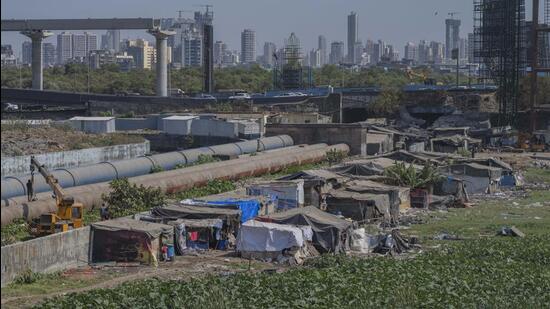 A wide nullah and water pipeline leading to the Western Express Highway (WEH) separates the plot into two halves (Satish Bate/ Hindustan Times) A wide nullah and water pipeline leading to the Western Express Highway (WEH) separates the plot into two halves (Satish Bate/ Hindustan Times)