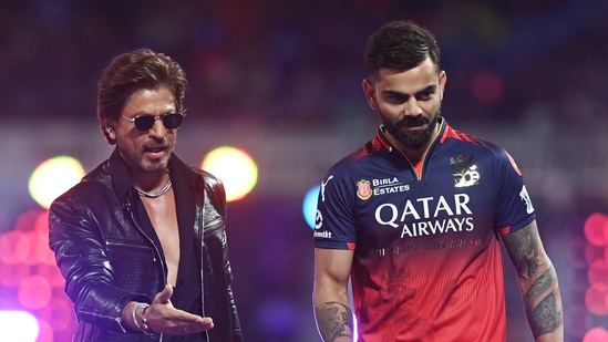 Royal Challengers Bangalore's Virat Kohli with Shah Rukh Khan before the match. The two danced to Jhoome Jo Pathan together. REUTERS/Abhijit Addya(REUTERS)
