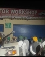 A video grab of a gathering outside a workshop in Lohsimbli village of Ghanaur in Patiala district on Saturday. (HT photo) A video grab of a gathering outside a workshop in Lohsimbli village of Ghanaur in Patiala district on Saturday. (HT photo)