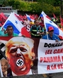 Demonstrators hold a banner reading “The Panama Canal is Not For Sale” with a picture of US President Donald Trump with a swastika during a protest in Panama City on January 20, 2025 (Photograph for representative purpose only). (AFP) Demonstrators hold a banner reading “The Panama Canal is Not For Sale” with a picture of US President Donald Trump with a swastika during a protest in Panama City on January 20, 2025 (Photograph for representative purpose only). (AFP)