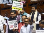 BJP and JDS members hold placards in protest demanding a judicial probe by a sitting High Court judge into the alleged ‘honey-trap’ attempt involving a minister and other politicians, during the Budget session of Karnataka Assembly, in Bengaluru, on Friday.(PTI file) BJP and JDS members hold placards in protest demanding a judicial probe by a sitting High Court judge into the alleged ‘honey-trap’ attempt involving a minister and other politicians, during the Budget session of Karnataka Assembly, in Bengaluru, on Friday.(PTI file)