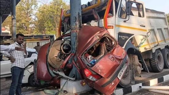 One car was completely mangled in the accident as it was stuck between an iron pillar and the dumper, killing two persons (Screengrab) One car was completely mangled in the accident as it was stuck between an iron pillar and the dumper, killing two persons (Screengrab)
