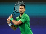 Novak Djokovic of Serbia returns a shot to Lorenzo Musetti of Italy during the Miami Open(Getty Images via AFP) Novak Djokovic of Serbia returns a shot to Lorenzo Musetti of Italy during the Miami Open(Getty Images via AFP)
