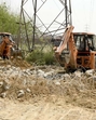 JCB’s razing wall of colonies in Ludhiana on Thursday. (Manish/HT) JCB’s razing wall of colonies in Ludhiana on Thursday. (Manish/HT)