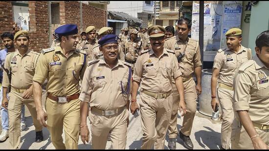 Police conduct a flag march a day after the arrest of Zafar Ali, Chairman of the Shahi Jama Masjid managing committee, in Sambhal, Monday. (PTI) Police conduct a flag march a day after the arrest of Zafar Ali, Chairman of the Shahi Jama Masjid managing committee, in Sambhal, Monday. (PTI)